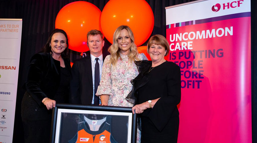 Principal Partner HCF were presented with a signed dress in recognition for their ongoing support from Netball NSW President Louise Sullivan, Captain Kim Green and Coach Julie Fitzgerald.