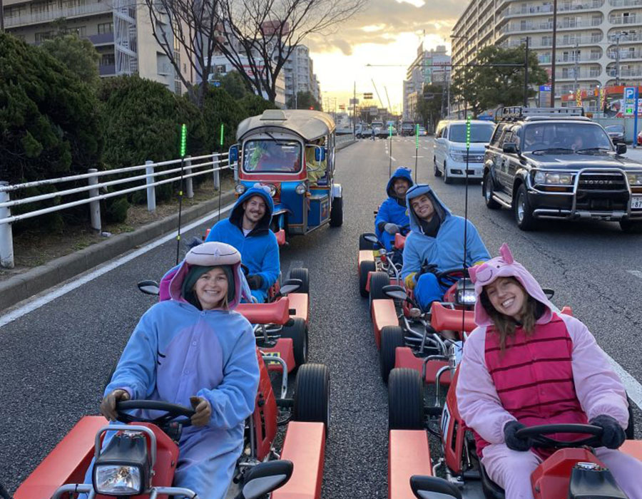 Group of people street karting in Japan